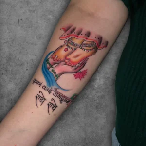 radha and krishna themed color tattoo with mantra (radhe-radhe) perfectly done by sachin at ortus tattoo, Laxmi nagar delhi.