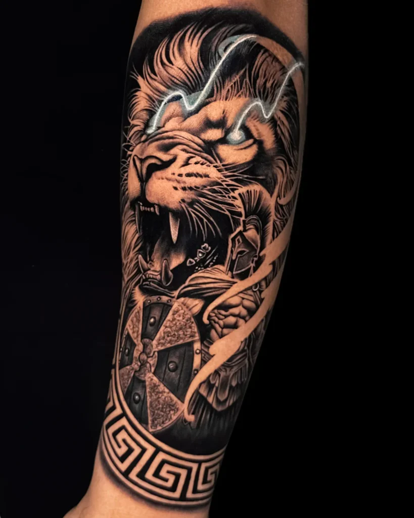 Realistic lion and spartan forearm tattoo for men at Ortus Tattoo-Delhi